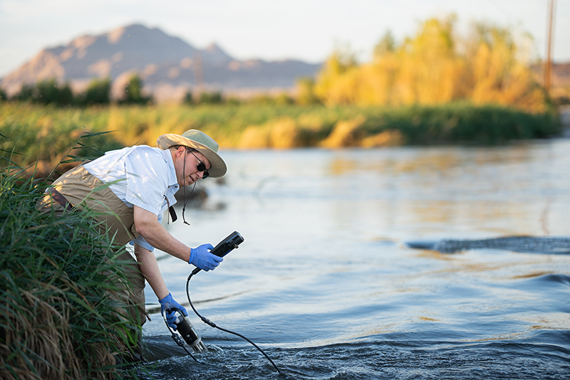 Duane Moser at wetlands just outside of Las Vegas, performing a variety of tests on the water.