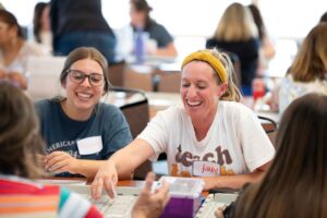 Two women laughing.